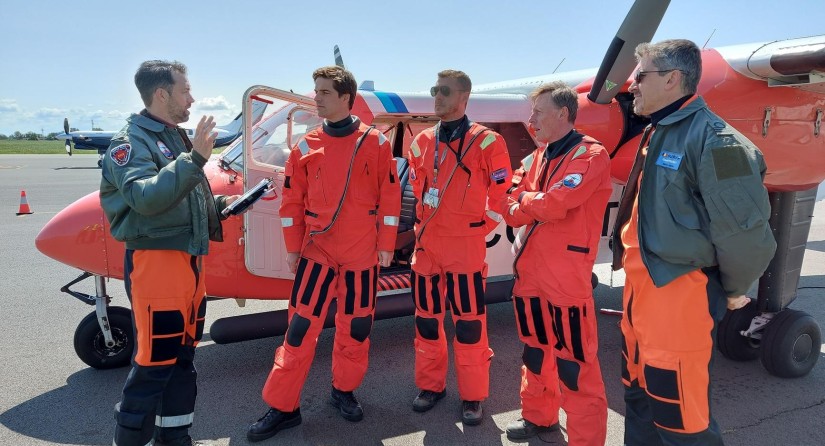 State Secretary for Science Policy Thomas Dermine receives a safety briefing before joining a flight over the North Sea.