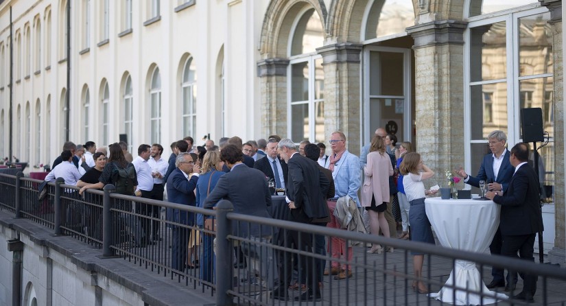 Guests enjoying a walking-dinner on the terrace